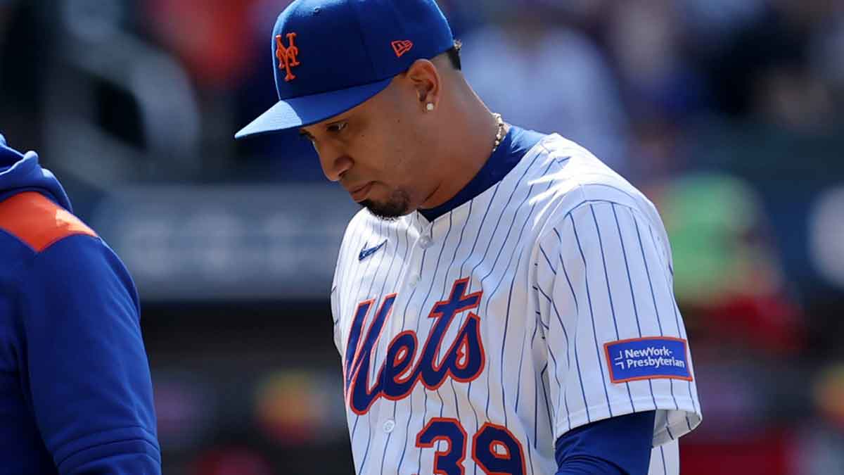 New York Mets relief pitcher Edwin Diaz (39) walks off the field after an injury during the tenth inning against the Philadelphia Phillies at Citi Field.