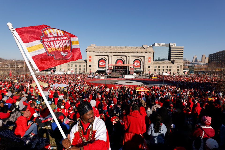 A general view as Kevin Moore of Kansas City waves a flag in front of Union Station prior to the Kansas City Chiefs Super Bowl LVIII victory parade on February 14, 2024