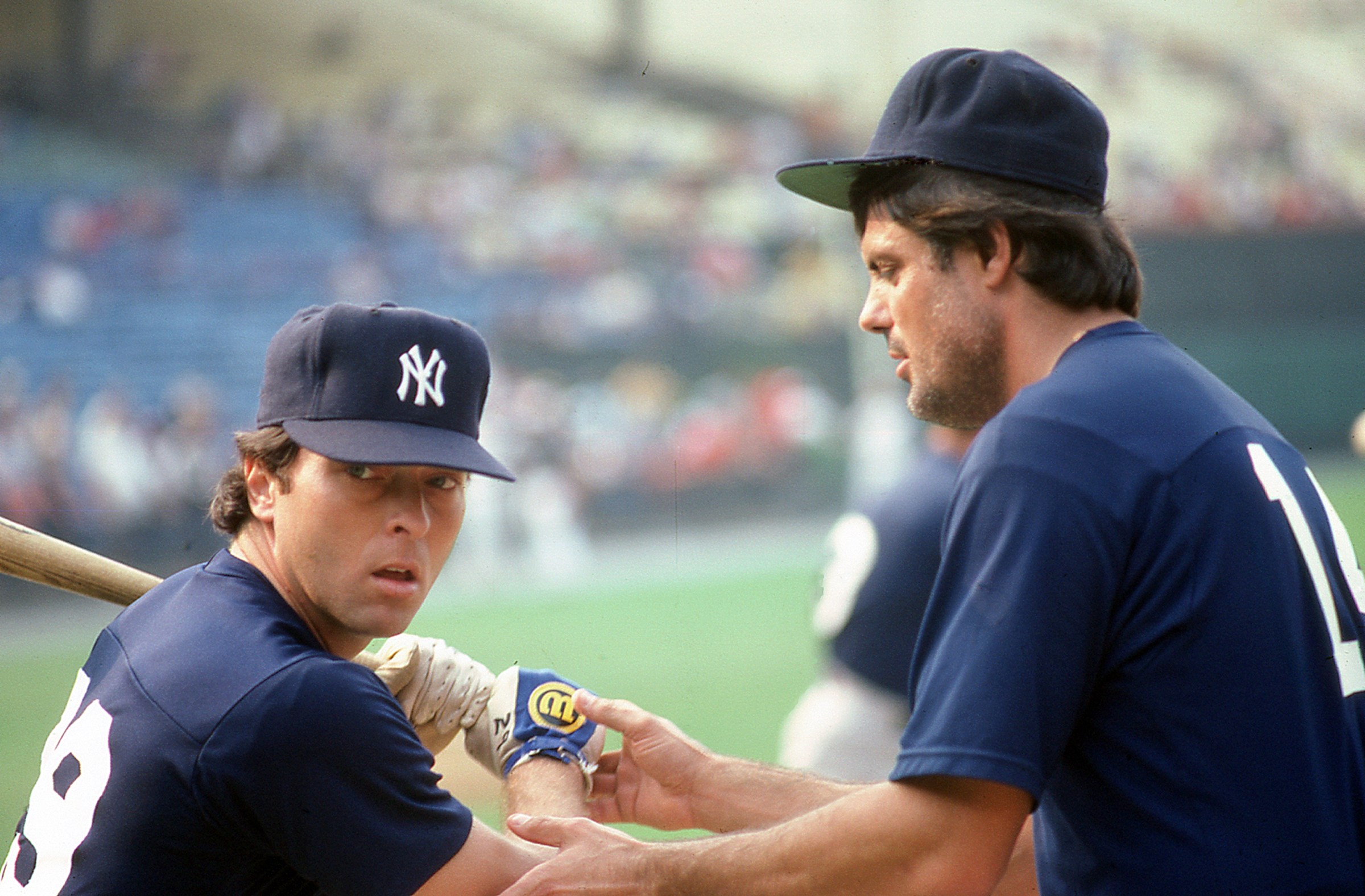BALTIMORE, MD – CIRCA 1982: Dave Collins (L) of the New York Yankees gets batting tips from teammate Lou Piniella (R) pregame against the Baltimore Orioles at Memorial Stadium circa 1982 in Baltimore, Maryland. (Photo by Owen C. Shaw/Getty Images)
