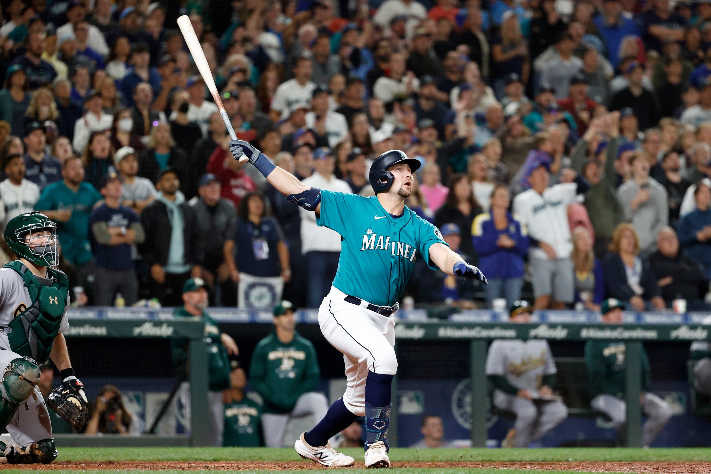 SEATTLE, WASHINGTON - SEPTEMBER 30: Cal Raleigh #29 of the Seattle Mariners celebrates his walk-off home run during the ninth inning against the Oakland Athletics at T-Mobile Park on September 30, 2022 in Seattle, Washington. With the win, the Seattle Mariners have clinched a postseason appearance for the first time in 21 years, the longest playoff drought in North American professional sports. (Photo by Steph Chambers/Getty Images)