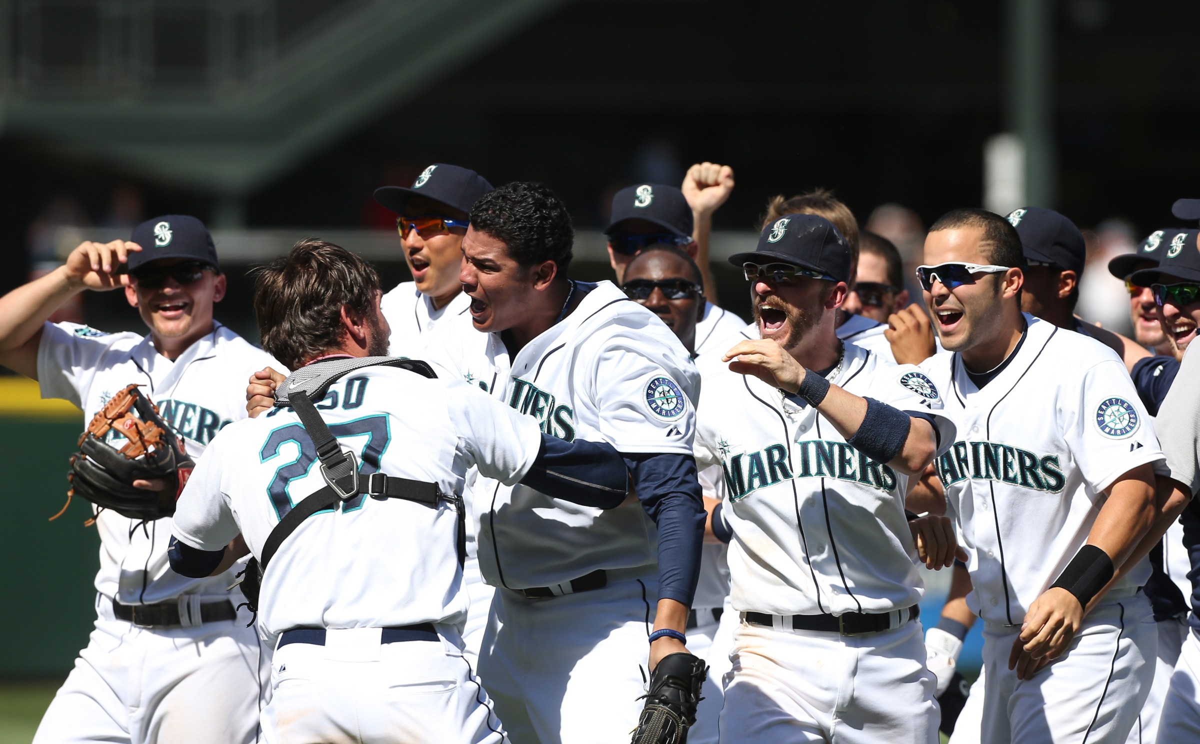 SEATTLE, WA - AUGUST 15: Starting pitcher Felix Hernandez #34 of the Seattle Mariners gets a hug from catcher John Jaso #27 after throwing a perfect game against the Tampa Bay Rays at Safeco Field on August 15, 2012 in Seattle, Washington. (Photo by Otto Greule Jr/Getty Images)