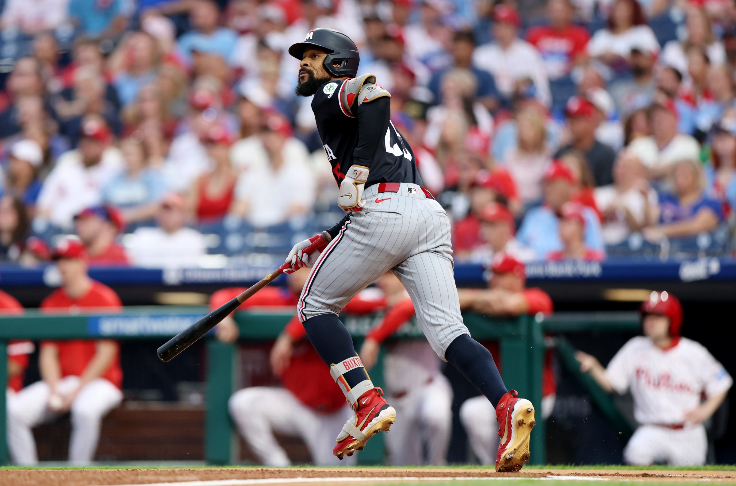 PHILADELPHIA, PENNSYLVANIA - SEPTEMBER 27: Byron Buxton #25 of the Minnesota Twins hits a solo home run in the first inning against the Philadelphia Phillies at Citizens Bank Park on September 27, 2025 in Philadelphia, Pennsylvania. (Photo by Emilee Chinn/Getty Images)