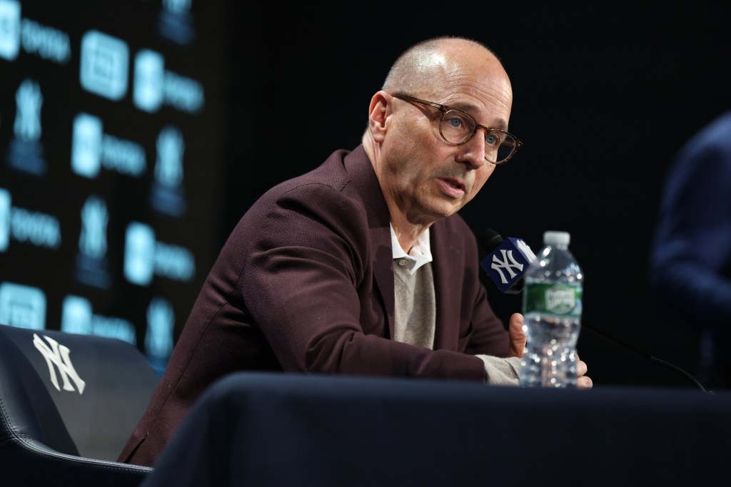 New York Yankees GM Brian Cashman speaking at a press conference.