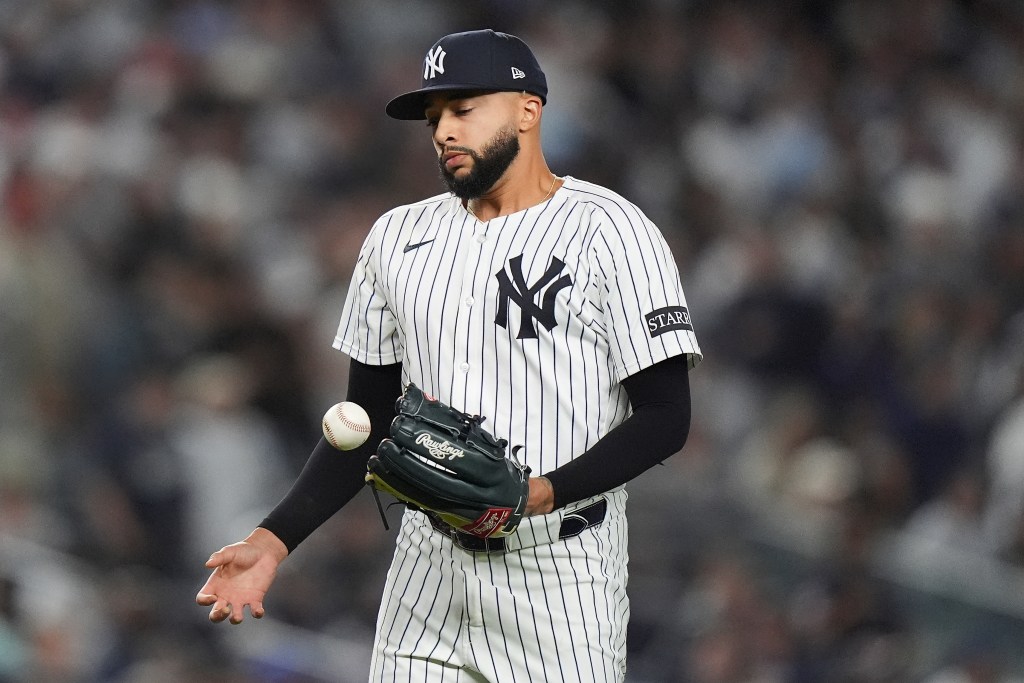 New York Yankees pitcher Devin Williams reacts after giving up a two-run RBI single to Toronto Blue Jays' Nathan Lukes during the seventh inning of Game 4 of baseball's American League Division Series.
