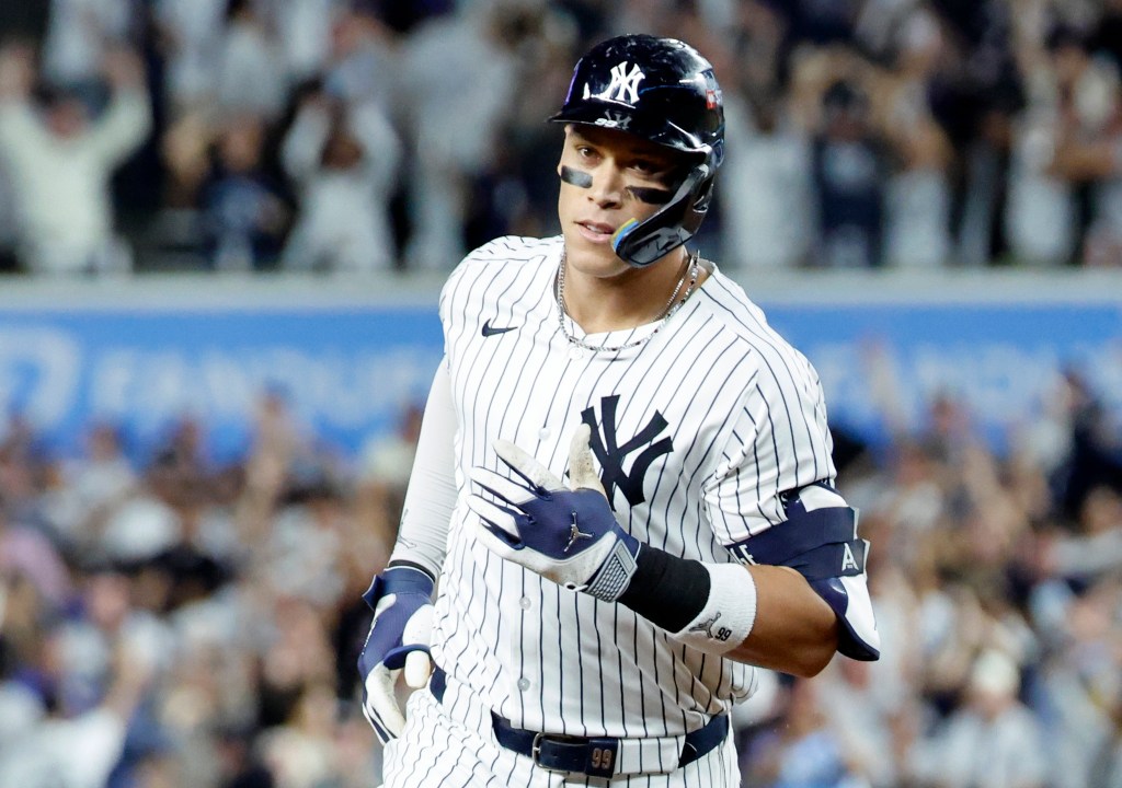 New York Yankees right fielder Aaron Judge reacts as he rounds the base on his three-run homer.