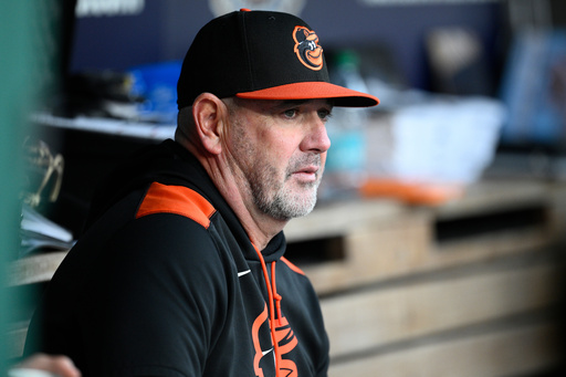 FILE - Baltimore Orioles manager Brandon Hyde looks on before a baseball game against the Washington Nationals, Tuesday, April 22, 2025, in Washington. (AP Photo/Nick Wass, File)