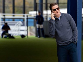 Toronto Blue Jays GM Ross Atkins takes a phone call during Spring Training action in Dunedin, Fla., Thursday, Feb. 15, 2024.