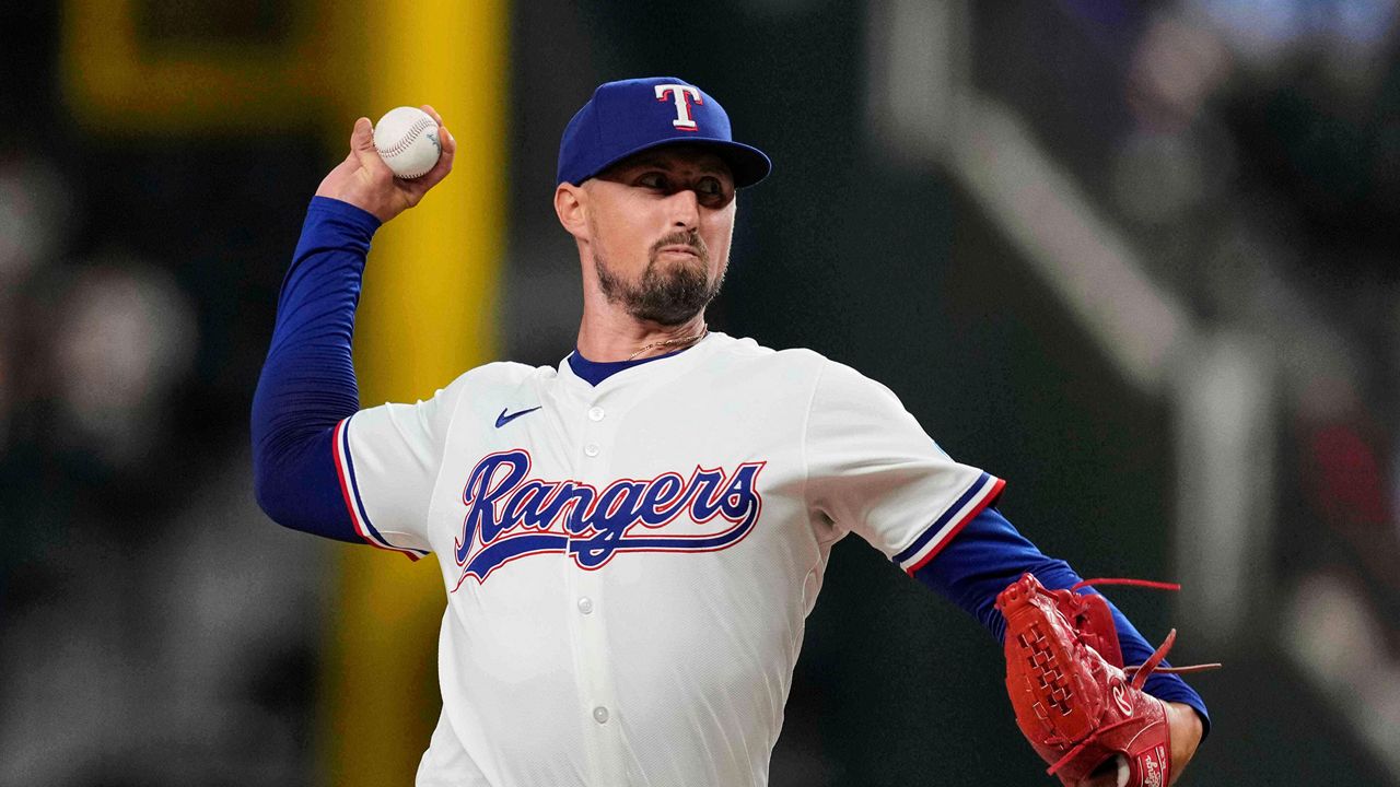 FILE - Texas Rangers relief pitcher Shawn Armstrong throws to the Arizona Diamondbacks in the eighth inning of a baseball game, Aug. 12, 2025, in Arlington, Texas. (AP Photo/Tony Gutierrez, File)