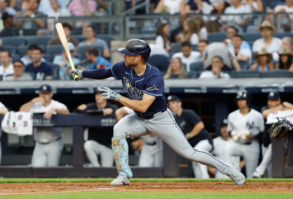 Tampa Bay Rays' Brandon Lowe hits an RBI double against the Yankees.