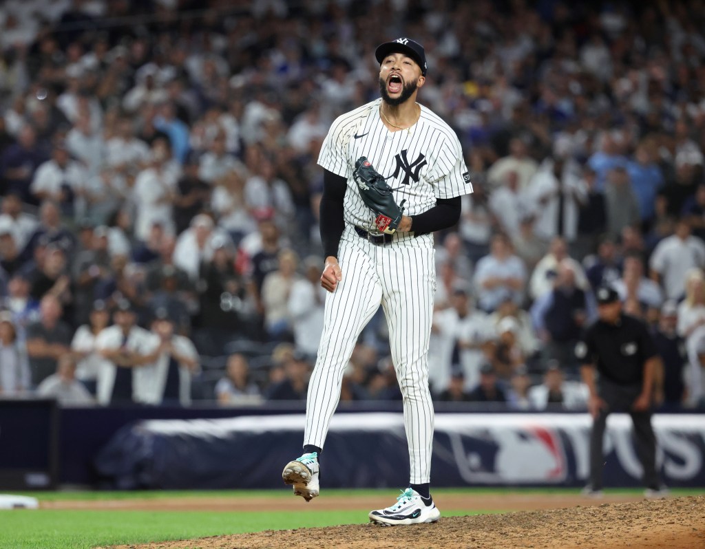 New York Yankees pitcher Devin Williams reacts after ending the 7th inning.