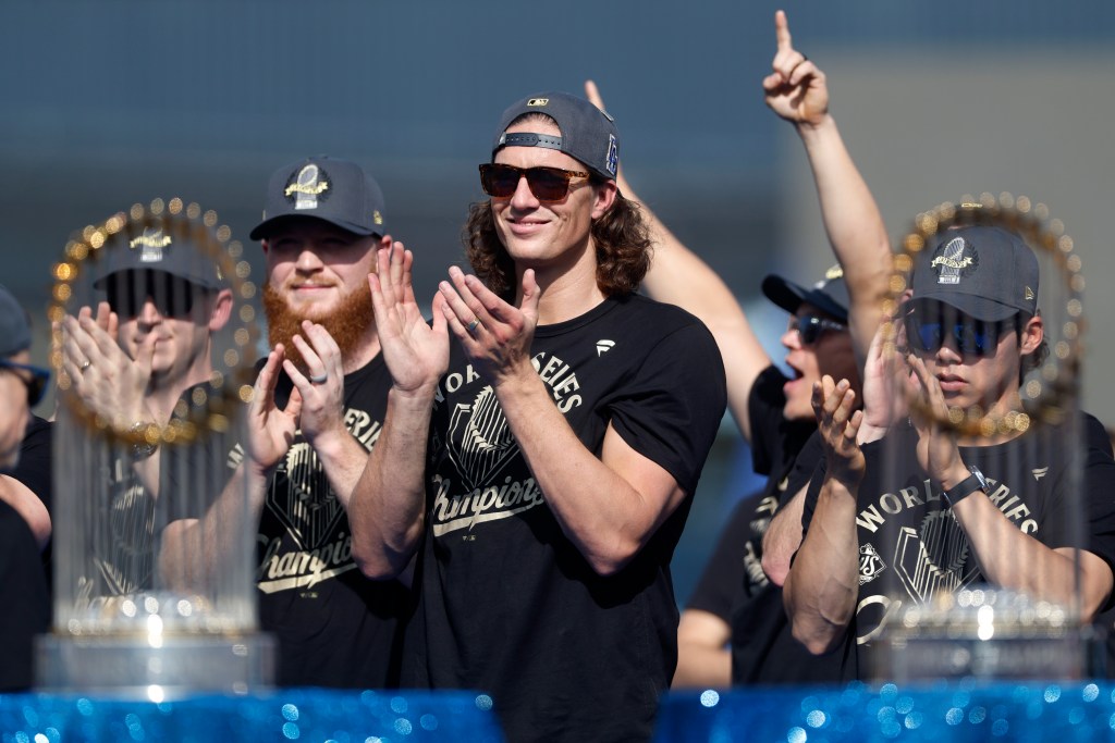 Tyler Glasnow of the Los Angeles Dodgers applauds during the World Series celebration.