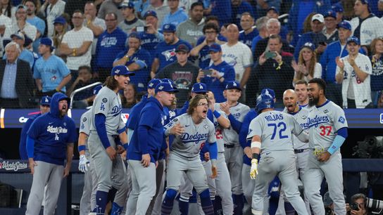 Los Angeles Dodgers second baseman Miguel Rojas (72) reacts after hitting a home run against the Toronto Blue Jays in the ninth inning for game seven of the 2025 MLB World Series at Rogers Centre. 