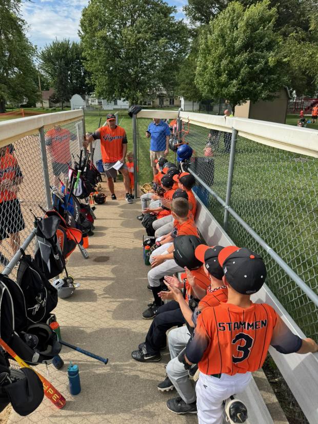 Craig Stammen coaches the Versailles Tigers 7U team in a tournament this past spring. In the foreground is his oldest son, Chase.