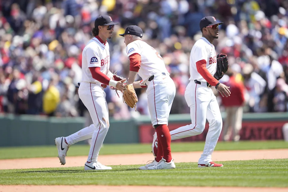 Apr 21, 2025; Boston, Massachusetts, USA; Boston Red Sox center fielder Jarren Duran (16) and Boston Red Sox third baseman Alex Bregman (2) shake hands to celebrate the victory after the ninth inning against the Chicago White Sox at Fenway Park. (Gregory Fisher/Imagn Images)