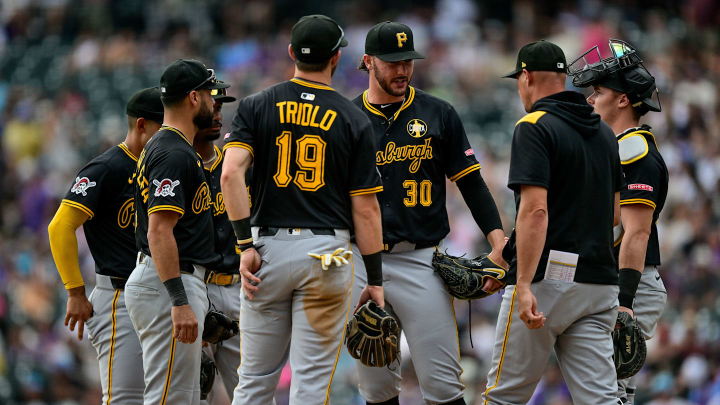 MLB: Pirates at Rockies — Paul Skenes and Don Kelly meet at the mound.