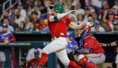 Mar 17, 2023; Miami, Florida, USA; Mexico second baseman Luis Urias (3) hits an RBI single during the seventh inning against Puerto Rico at LoanDepot Park. Mandatory Credit: Sam Navarro-Imagn Images