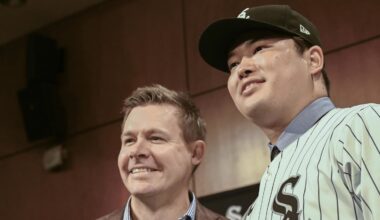 Dec 22, 2025; Chicago, Il, USA;  New Chicago White Sox player Munetaka Murakami, right, dons his hat with General Manager Chris Getz, left,  during a press conference  where he was introduced at Rate Field. Mandatory Credit: Matt Marton-Imagn Images