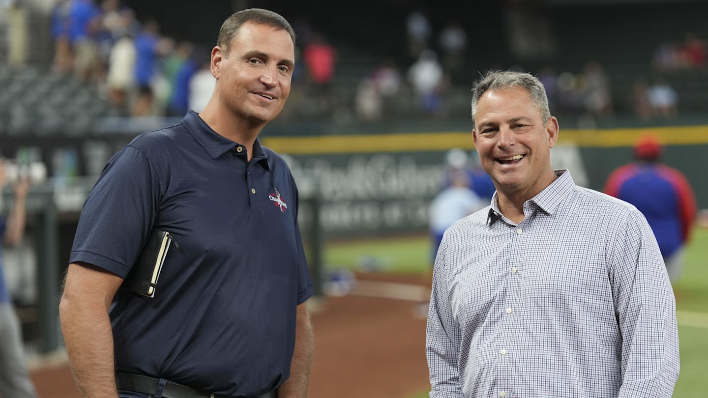 Jun 21, 2024; Arlington, Texas, USA; Texas Rangers general manager Chris Young (left) and Kansas City Royals general manager J.J. Picollo (right) talk before the game against the Kansas City Royals at Globe Life Field. Mandatory Credit: Jim Cowsert-Imagn Images