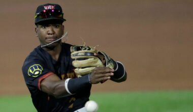 Wisconsin Timber Rattlers' Luis Pena (2) throws to first base against the Quad Cities River Bandits during their baseball game Wednesday, August 27, 2025, at Neuroscience Group Field at Fox Cities Stadium in Grand Chute, Wisconsin. Quad City won 9-5.