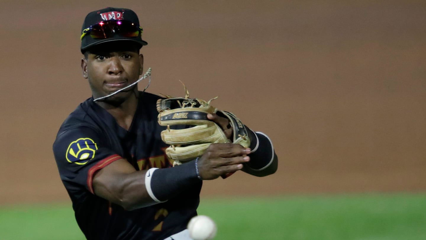 Wisconsin Timber Rattlers' Luis Pena (2) throws to first base against the Quad Cities River Bandits during their baseball game Wednesday, August 27, 2025, at Neuroscience Group Field at Fox Cities Stadium in Grand Chute, Wisconsin. Quad City won 9-5.