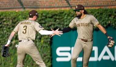 May 24, 2025; Atlanta, Georgia, USA; San Diego Padres right fielder Fernando Tatis Jr. (23) celebrates after a catch with center fielder Jackson Merrill (3) against the Atlanta Braves in the first inning at Truist Park. Mandatory Credit: Brett Davis-Imagn Images
