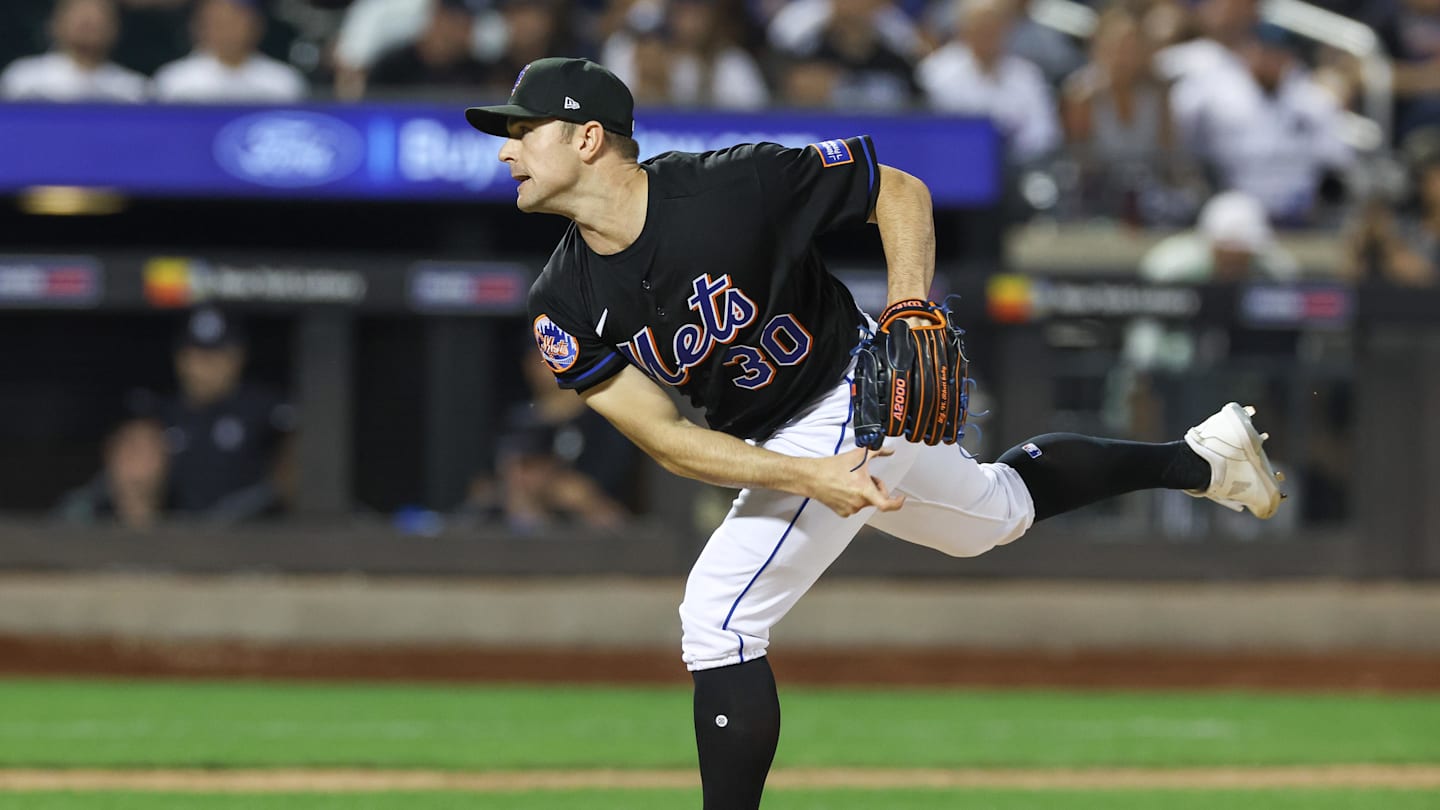 Jun 13, 2023; New York City, New York, USA; New York Mets relief pitcher David Robertson (30) delivers a pitch  during the ninth inning against the New York Yankees at Citi Field. Mandatory Credit: Vincent Carchietta-Imagn Images