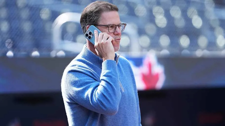 Toronto Blue Jays general manager Ross Atkins talks on phone
