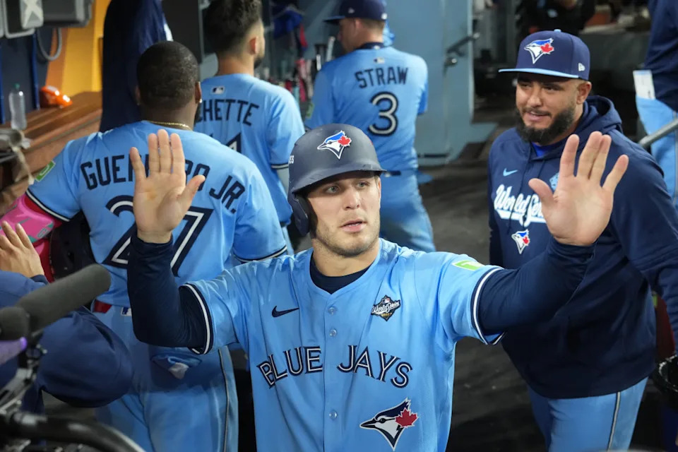 Toronto Blue Jays center fielder Daulton Varsho (5) celebrates against the Los Angeles Dodgers in the World Series.© Kirby Lee-Imagn Images