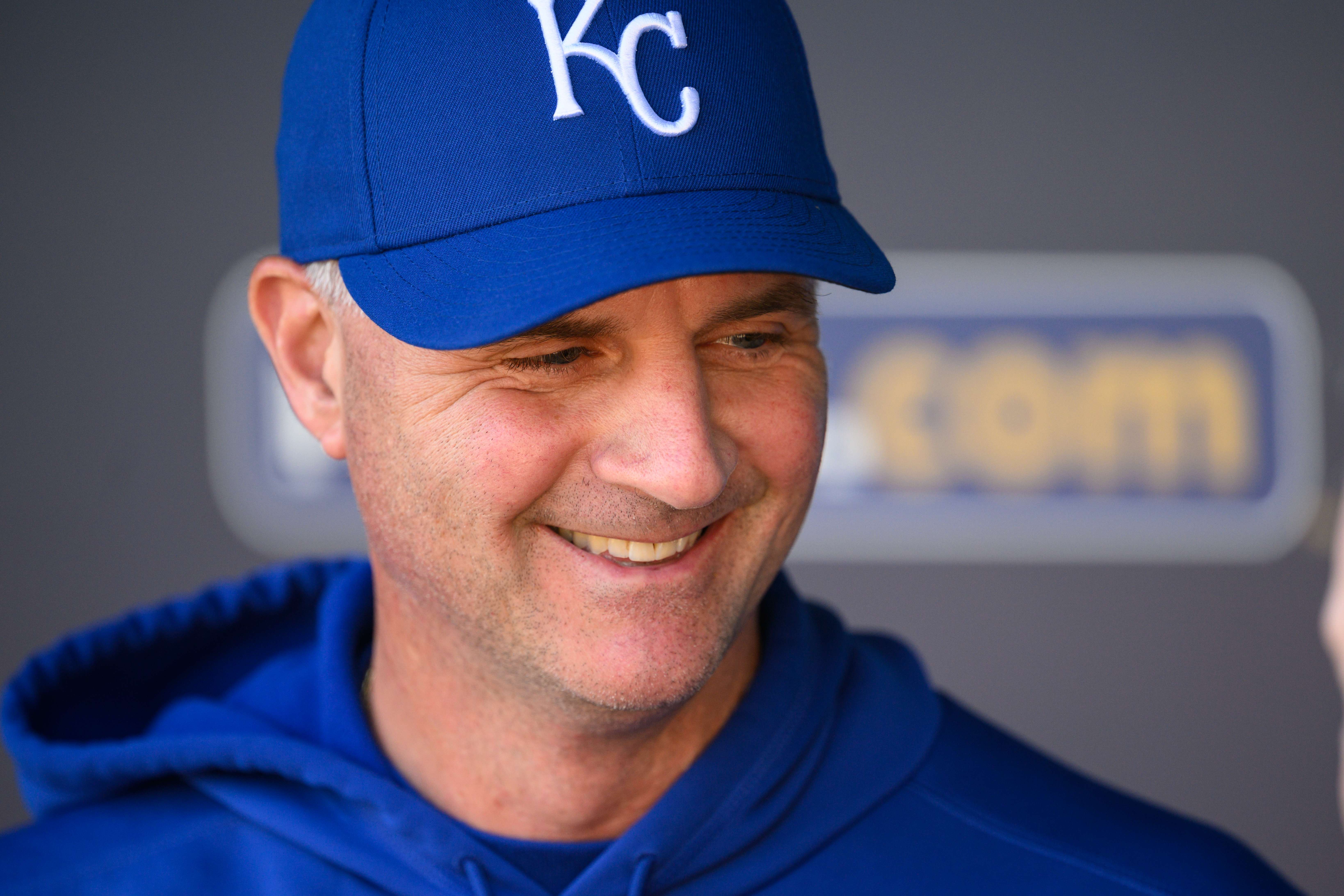 Kansas City Royals manager Matt Quatraro (33) chats in the dugout during warmups before their baseball game against the Minnesota Twins, Sunday, April 2, 2023 in Kansas City, Mo. (AP Photo/Reed Hoffmann)