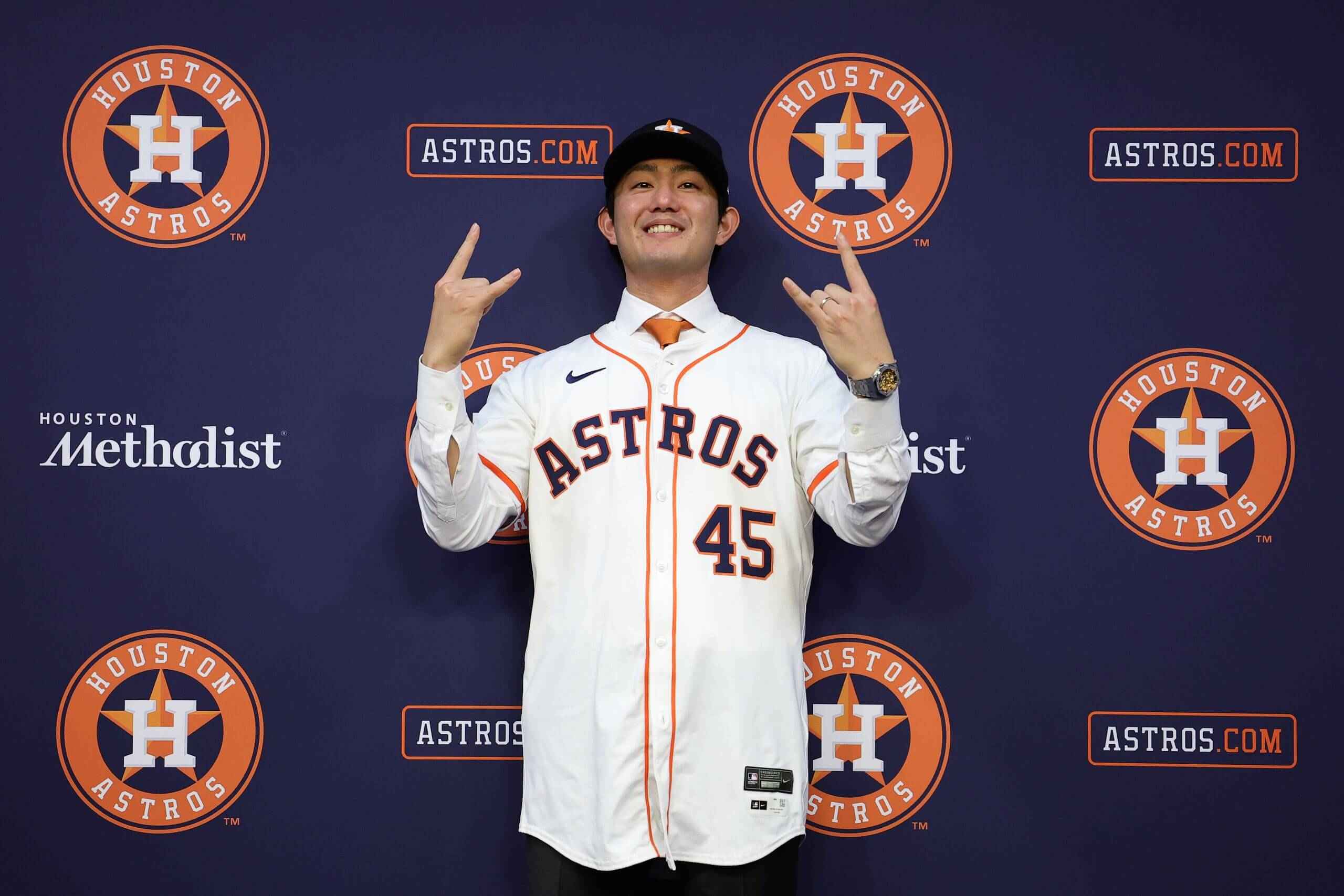 Tatsuya Imai smiles and gives a hang-loose gesture at his Astros introductory press conference.