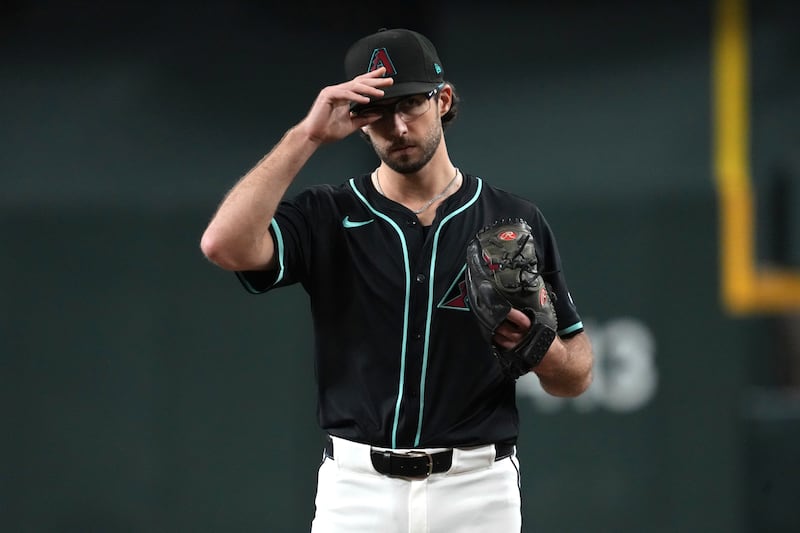 Arizona Diamondbacks pitcher Zac Gallen (23) throws against the Philadelphia Phillies in the first inning of a baseball game, Saturday, Sept. 20, 2025, in Phoenix. (AP Photo/Rick Scuteri)