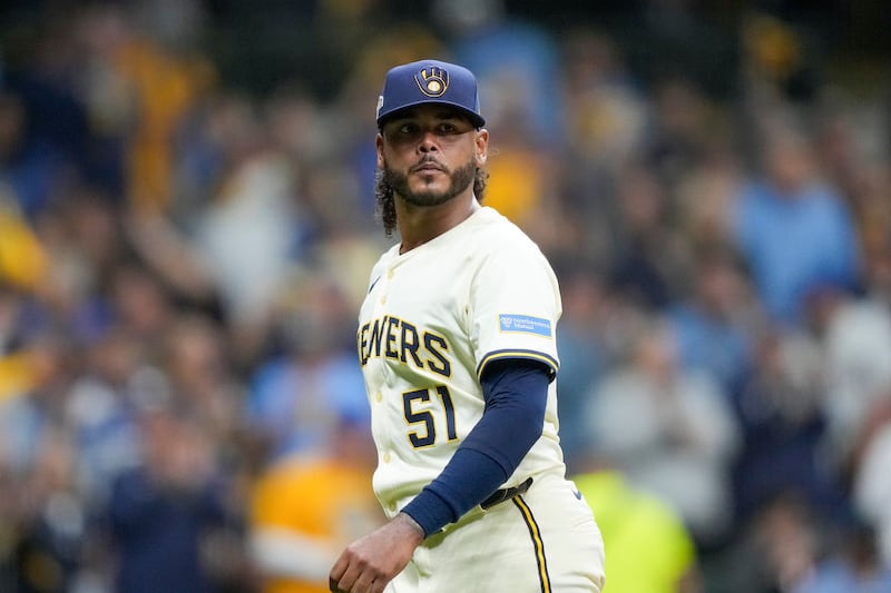 Milwaukee Brewers pitcher Freddy Peralta walks to the dugout after the top of the fifth inning in Game 2 of baseball's National League Championship Series against the Los Angeles Dodgers, Tuesday, Oct. 14, 2025, in Milwaukee. (AP Photo/Brynn Anderson)
