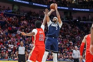 Dallas Mavericks forward Anthony Davis (3) goes up to shoot a jumper over New Orleans...