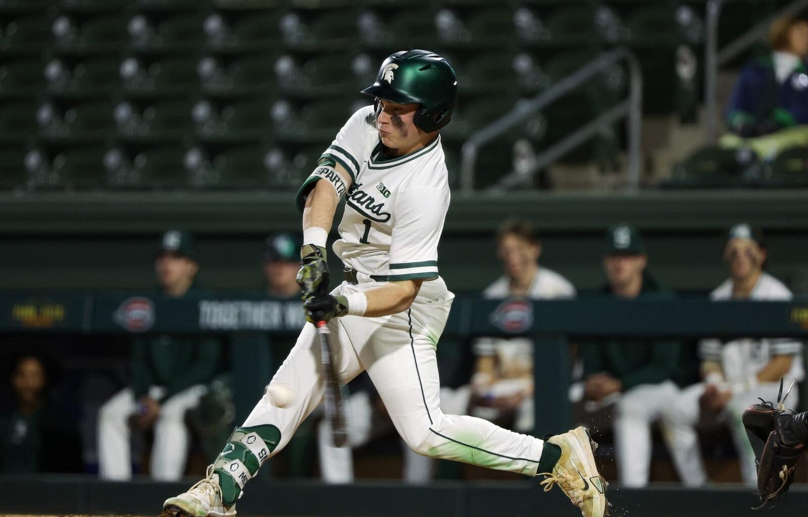 Spartan head three baseballs hand