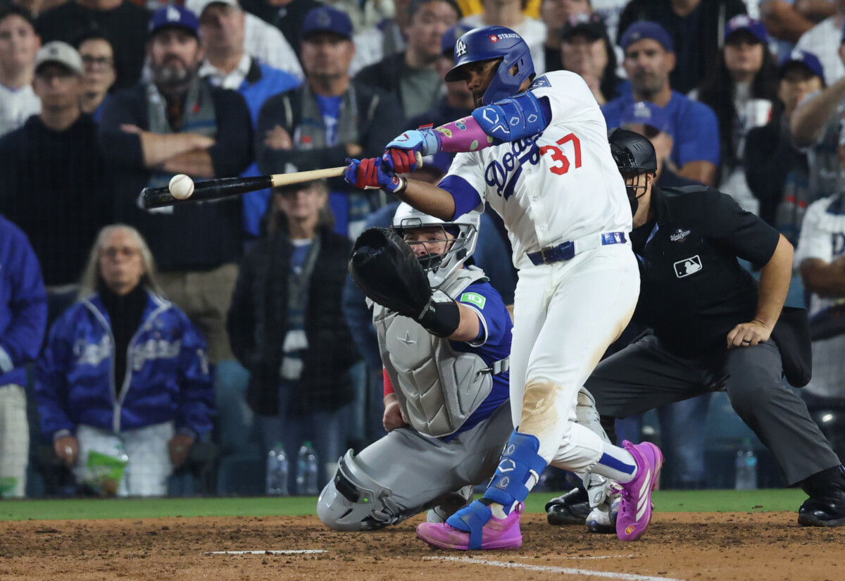 Los Angeles Dodgers outfielder Teoscar Hernández hitting a single in the 2025 World Series.