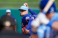 Texas Rangers pitcher Nathan Eovaldi delivers to Kansas City Royals second baseman Michael...