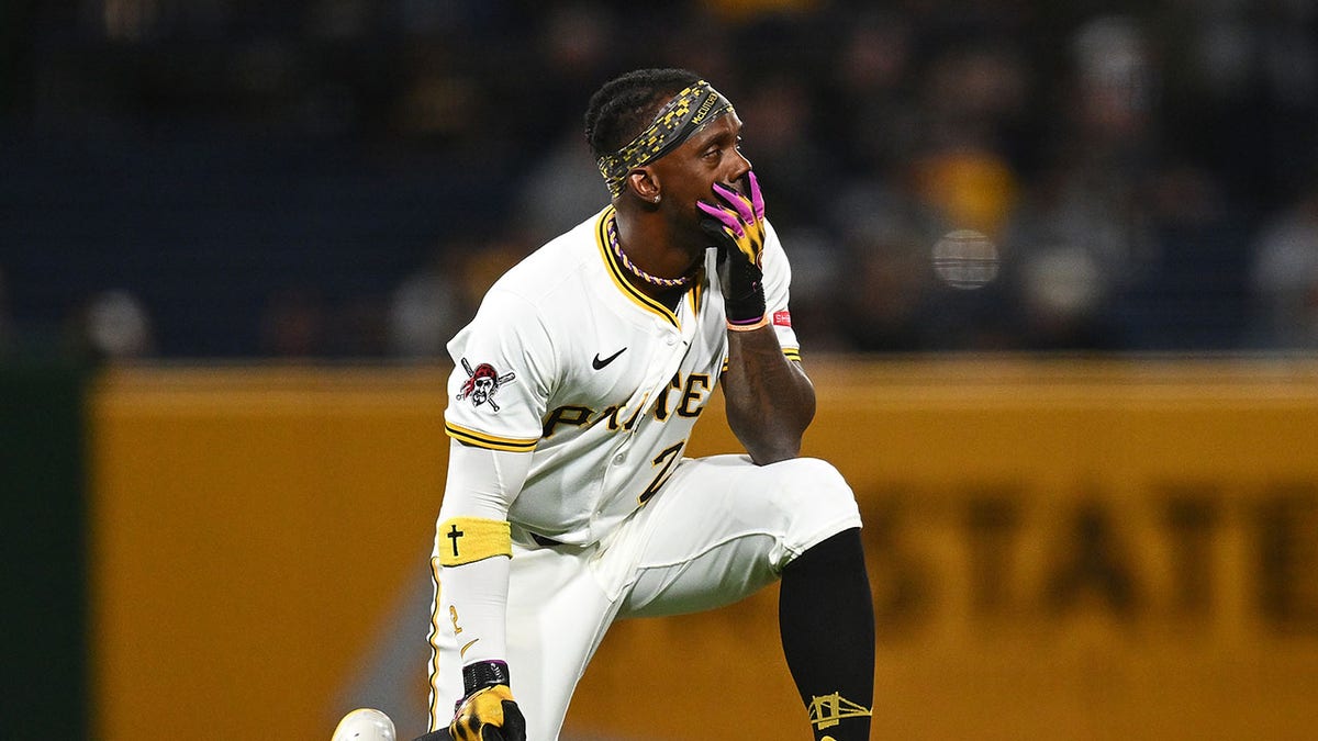 Andrew McCutchen on one knee
