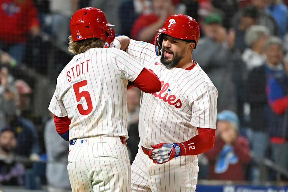 Sep 9, 2025; Philadelphia, Pennsylvania, USA; Philadelphia Phillies outfielder Kyle Schwarber (12) celebrates his 50th home run of the season with second base Bryson Stott (5) during the seventh inning against the New York Mets at Citizens Bank Park. Mandatory Credit: Eric Hartline-Imagn Images