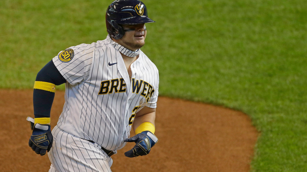Milwaukee Brewers' Daniel Vogelbach smiles as he rounds third base after hitting a three-run home run during the sixth inning of a game against the Kansas City Royals Sunday, Sept. 20, 2020, in Milwaukee. (AP Photo/Aaron Gash)