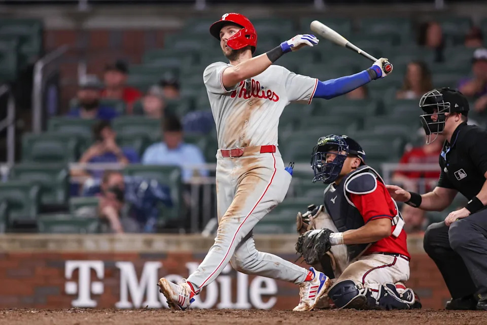 Jun 27, 2025; Atlanta, Georgia, USA; Philadelphia Phillies shortstop Trea Turner (7) hits a home run against the Atlanta Braves in the ninth inning at Truist Park. Mandatory Credit: Brett Davis-Imagn Images