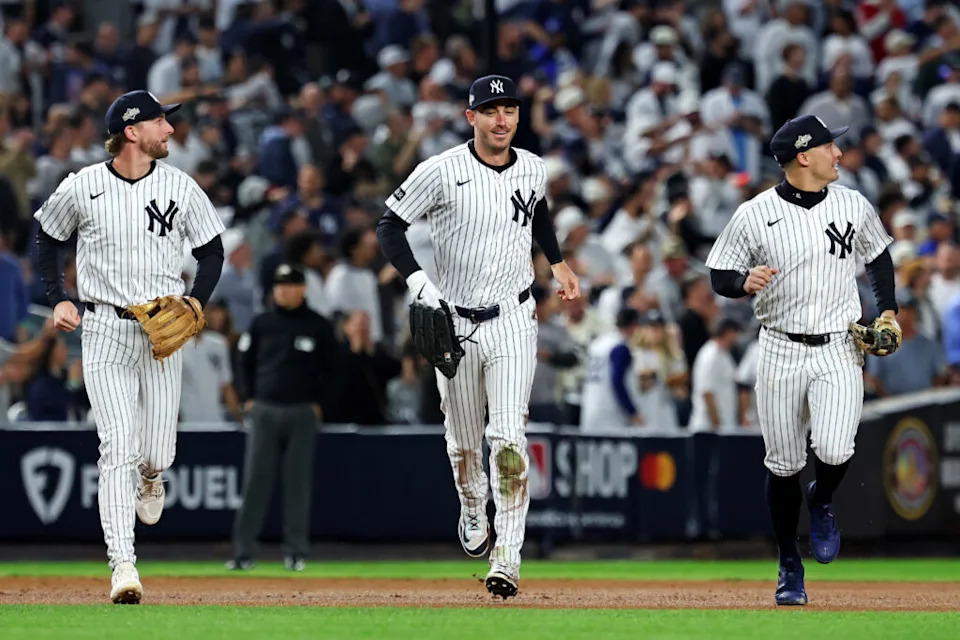 Oct 8, 2025; Bronx, New York, USA; New York Yankees left fielder Cody Bellinger (35) runs off the field after ending the first inning with a sliding catch against the Toronto Blue Jays during game four of the ALDS round for the 2025 MLB playoffs at Yankee Stadium. Mandatory Credit: Vincent Carchietta-Imagn Images