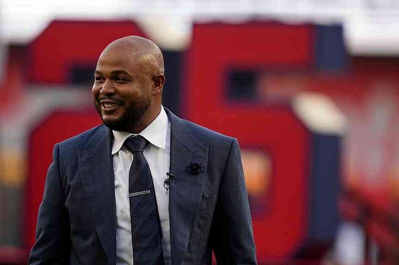 FILE - Former Atlanta Braves player Andruw Jones walks on the field as his number is retired Sept. 9, 2023, in Atlanta. (AP Photo/Brynn Anderson, File)