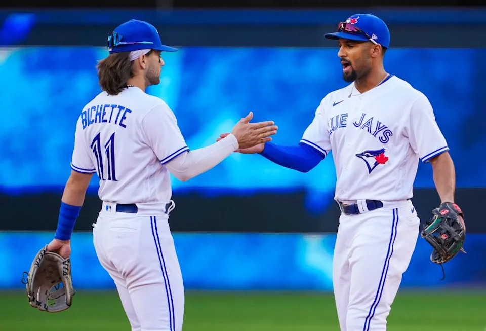 Marcus Semien and Bo Bichette of the Toronto Blue Jays celebrate defeating the Minnesota Twins in their MLB game at the Rogers Centre on September 18, 2021 in Toronto, Ontario, Canada. Getty Images