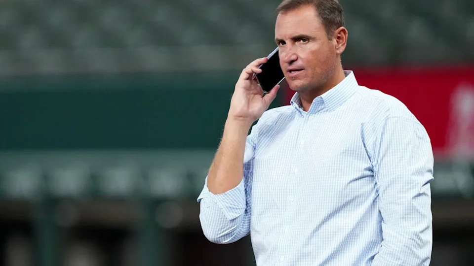 <div>ARLINGTON, TEXAS - AUGUST 19: General manager Chris Young of the Texas Rangers talks on a mobile phone before the game against the Pittsburgh Pirates at Globe Life Field on August 19, 2024 in Arlington, Texas. (Photo by Sam Hodde/Getty Images)</div>