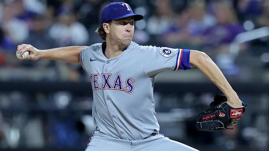 Texas Rangers starting pitcher Jacob deGrom throws a baseball.