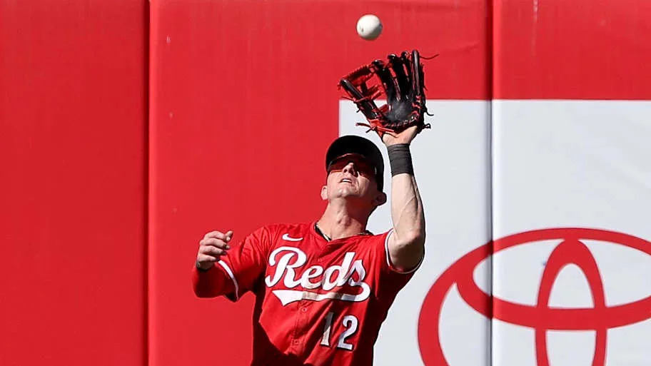 Austin Hays of Cincinnati Reds catches fly ball