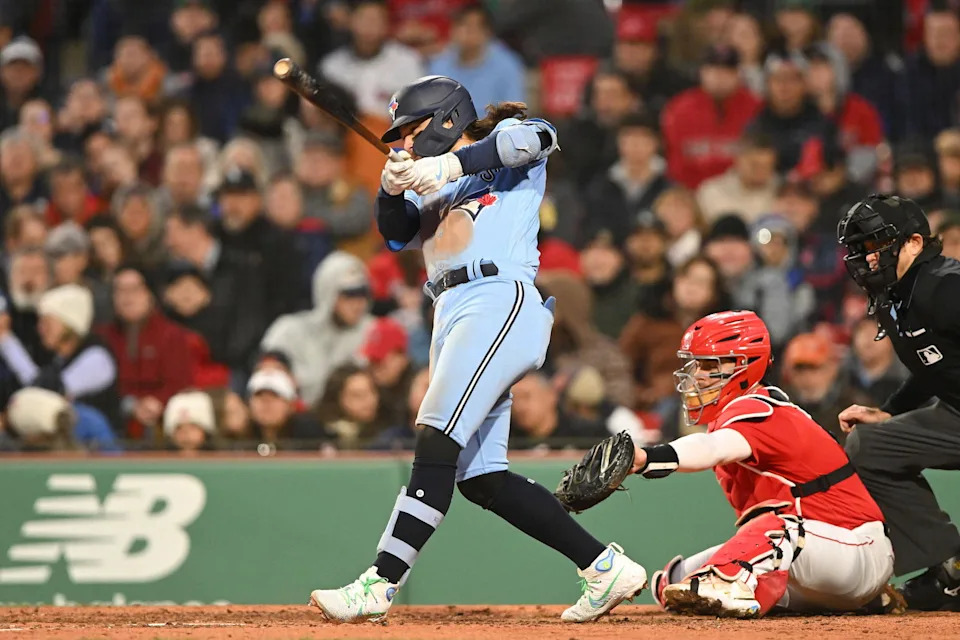 May 4, 2023; Boston, Massachusetts, USA; Toronto Blue Jays shortstop Bo Bichette (11) hits a two RBI single against the Boston Red Sox during the fifth inning at Fenway Park. (Brian Fluharty/Imagn Images)