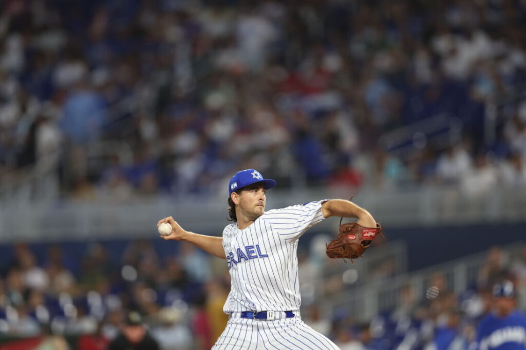 A man about to throw a baseball.