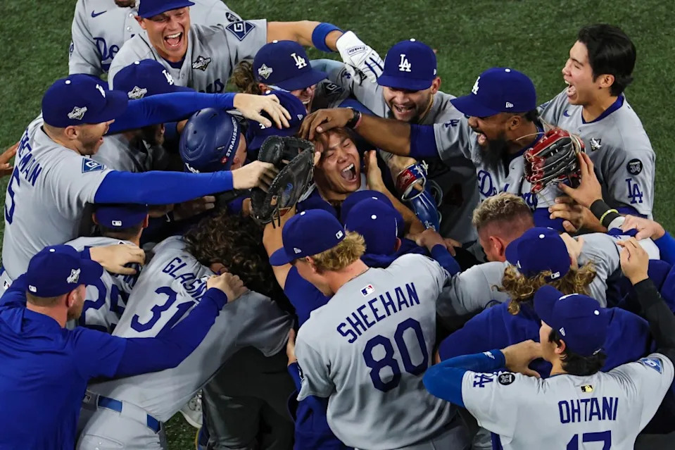 Pitcher Yoshinobu Yamamoto #18 of the LA Dodgers (R) celebrates with teammates after defeating the Toronto Blue Jays, 5-4, in game seven of the 2025 World Series. Getty Images