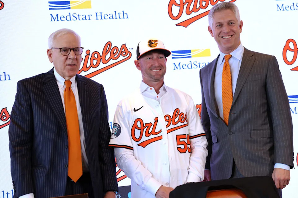 Nov 4, 2025; Baltimore, MD, USA; From left to right: Baltimore Orioles Owner David Rubenstein, Baltimore Orioles Manager Craig Albernaz and President of Baseball Operations Mike Elias pose for a photo during a press conference at Warehouse Bar. Mandatory Credit: Daniel Kucin Jr.-Imagn Images